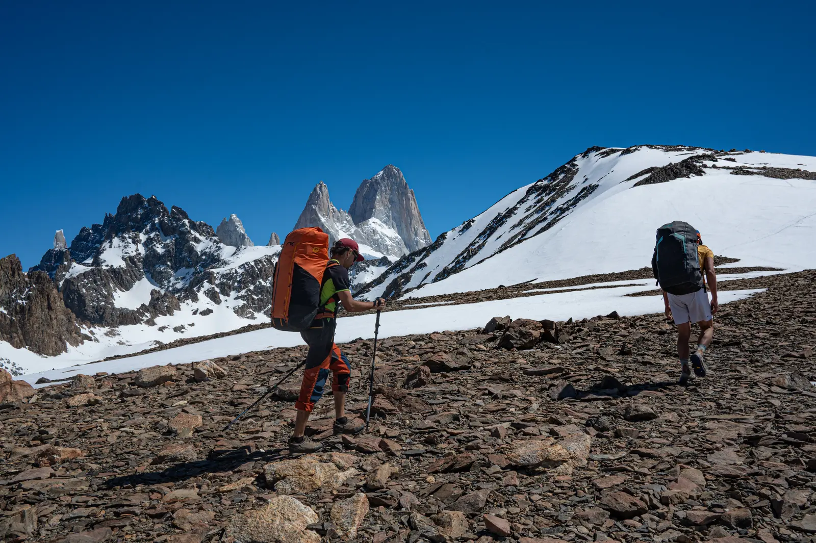 Climbing over rock and snow, with Fitz Roy behind